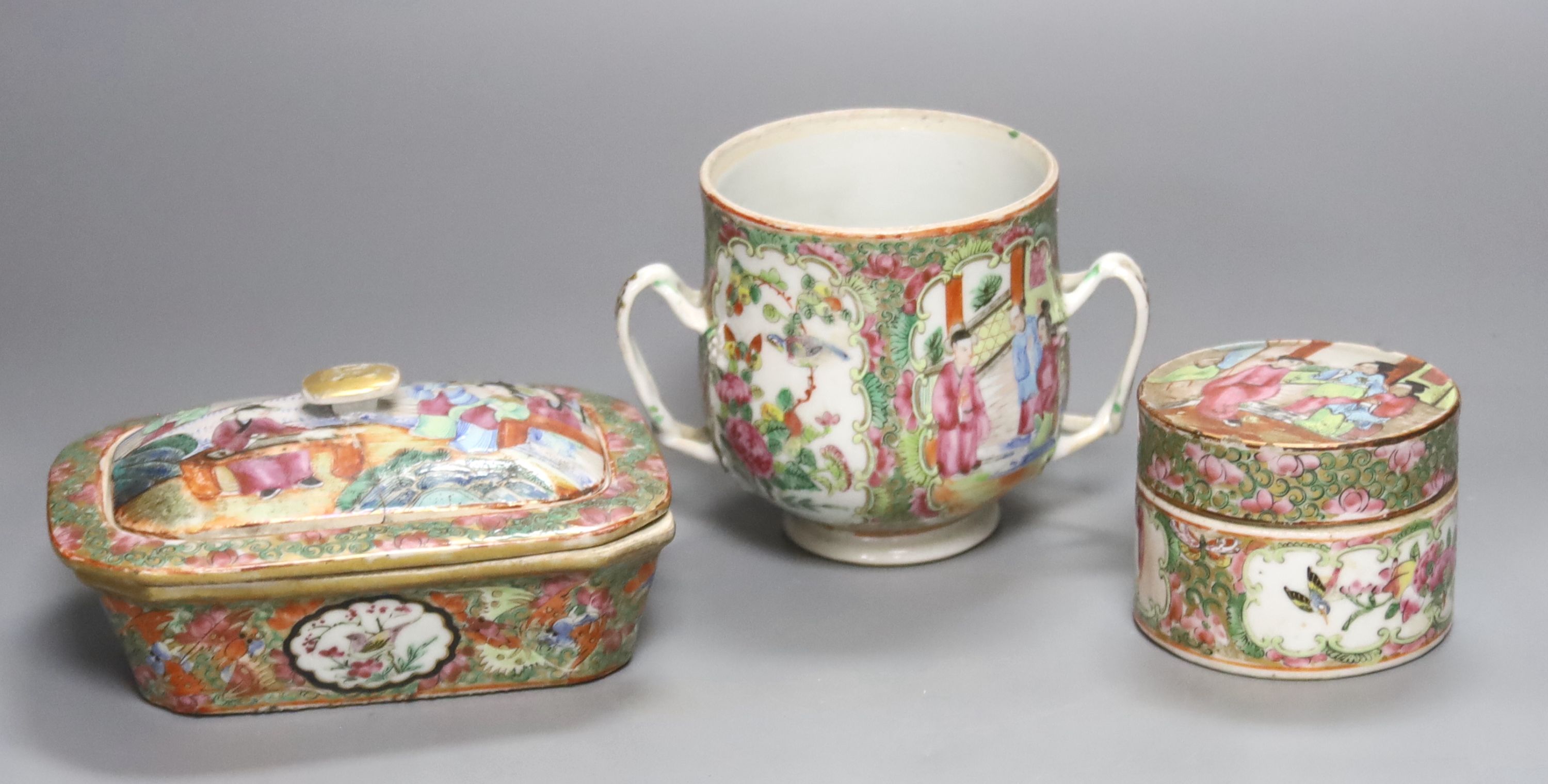 A Chinese famille rose soap dish strainer and cover, a two handled cup and a box and cover, 19th century, tallest 10cm